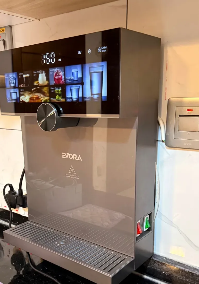 Original photograph of the actual Evora countertop dispenser installed in a kitchen